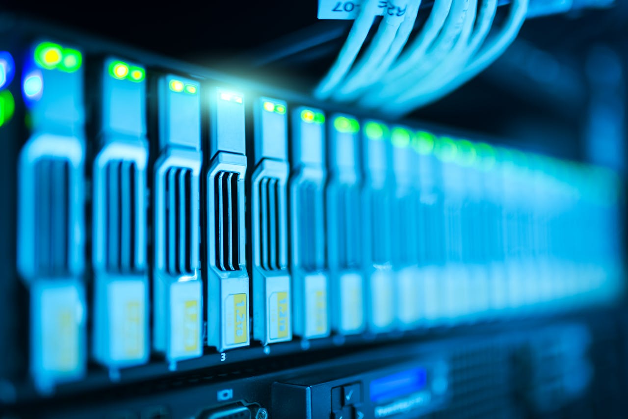 about-03 Detailed image of a server rack with glowing lights in a modern data center.