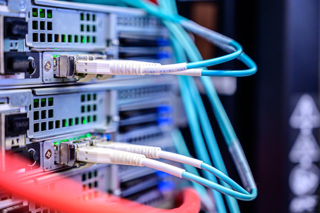 about-04 Detailed shot of Ethernet cables connected to server ports highlighting technology infrastructure.